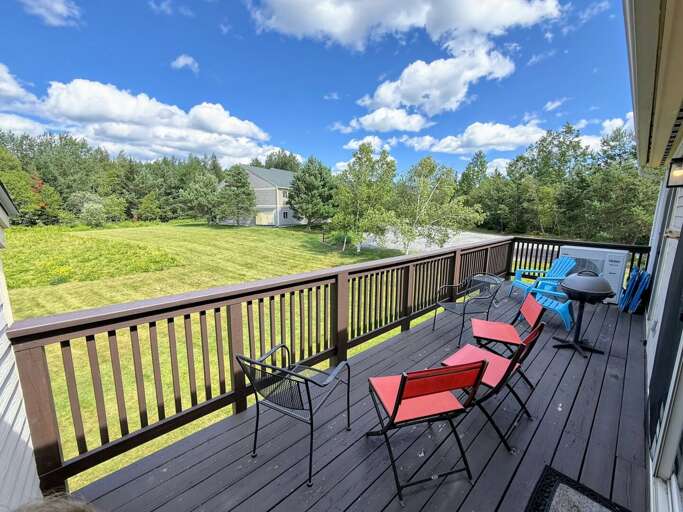 Back deck with seating.