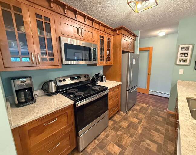 Kitchen with stainless steel appliances.