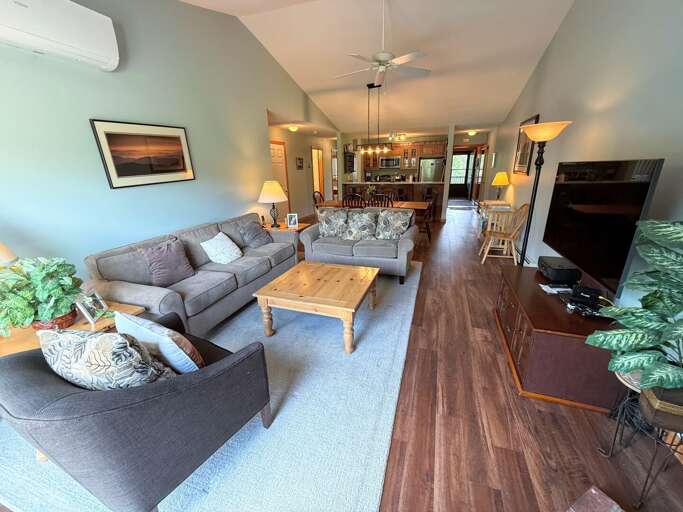 Living area with gas fireplace, comfortable seating, Smart TV, DVD player and walkout to the deck.