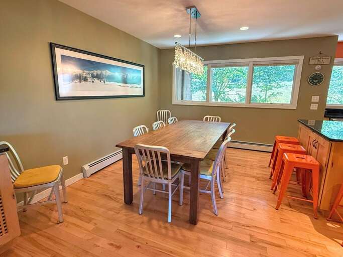 Dining area with seating for 10 and breakfast bar with 4 stools