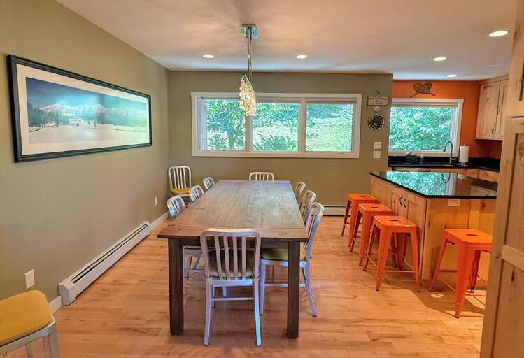 Dining area with seating for 10 and breakfast bar with 4 stools
