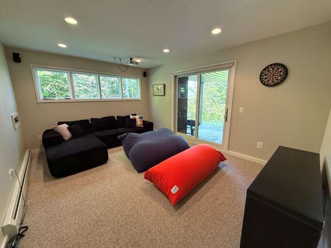 This lower level entertainment area has a projection display and surround sound speakers.