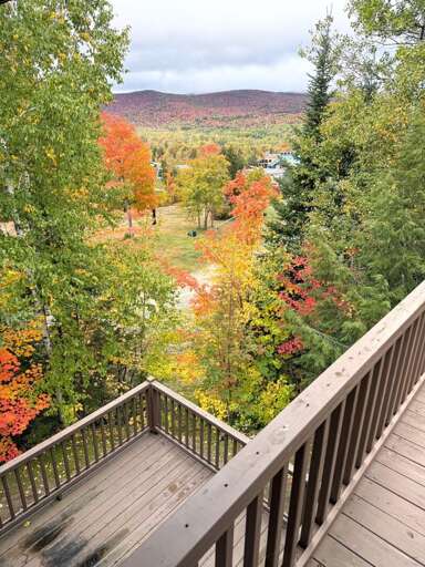 Both decks look out over the beginner ski trail and the Presidential Range.