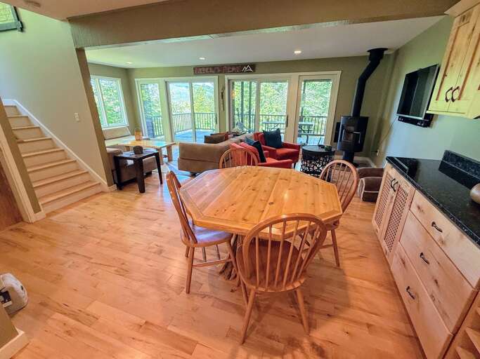 Secondary dining table adjacent to living area and kitchen/dining room.