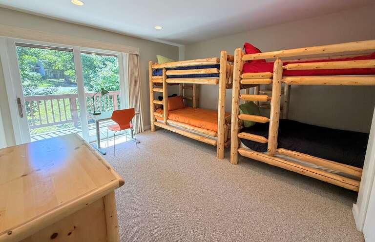 Upper level bedroom with 2 twin-over-twin bunk beds.