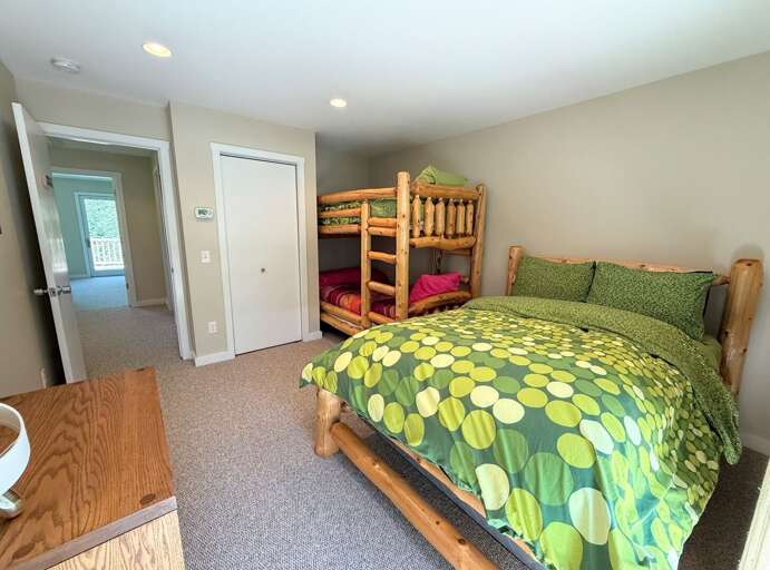 Upper level bedroom with full bed and twin-over-twin bunk + walkout to shared deck