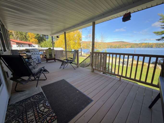 Main Level Deck with Seating Area, Dining Table, Gas Grill and Charcoal Smoker