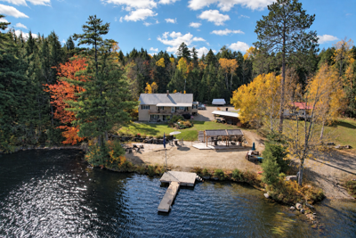 Welcome to this Private Lakefront Home on Forest Lake!