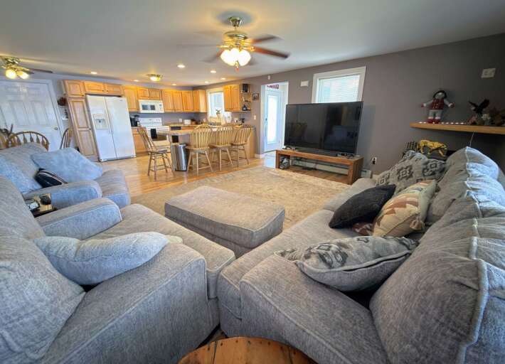 Main Level Living Room adjacent to Kitchen and Dining Areas