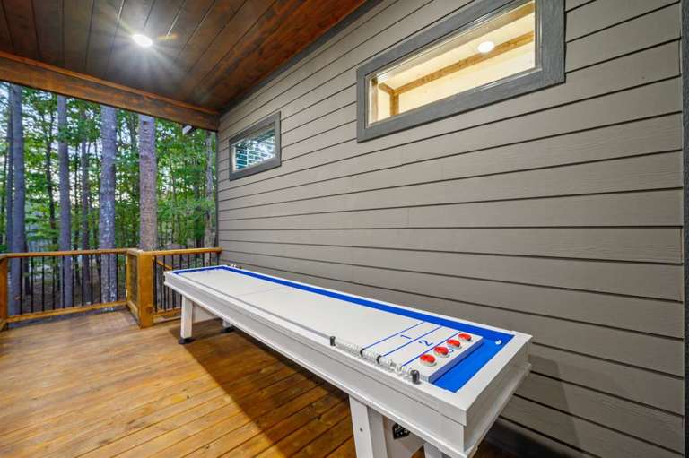 Outdoor shuffleboard table on the deck Outdoor shuffleboard table on the deck
