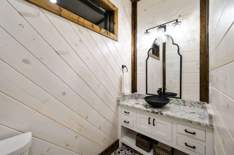 Half bath is conveniently located adjacent to the kitchen Half bath is conveniently located adjacent to the kitchen