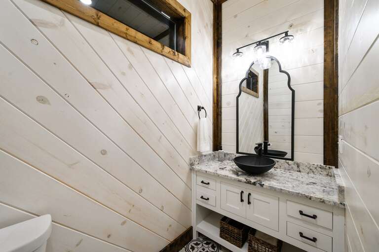 Half bath is conveniently located adjacent to the kitchen