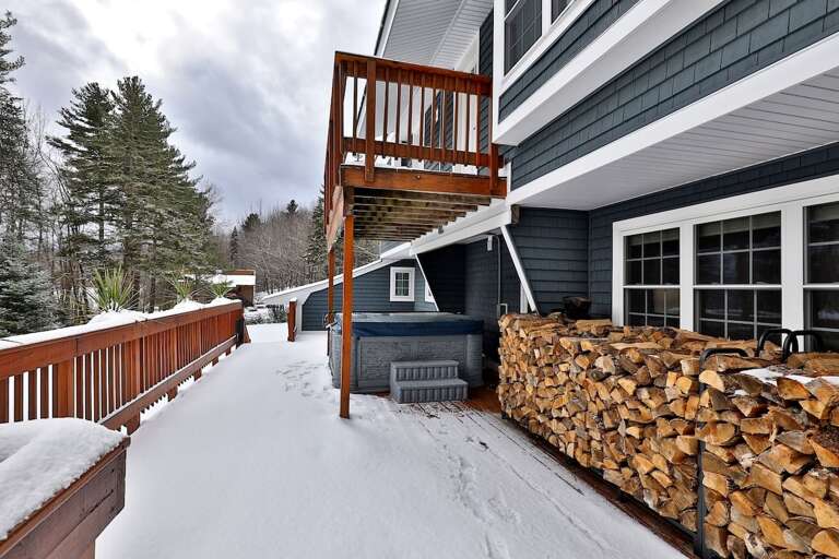 Firewood and hot tub await our guests over the winter