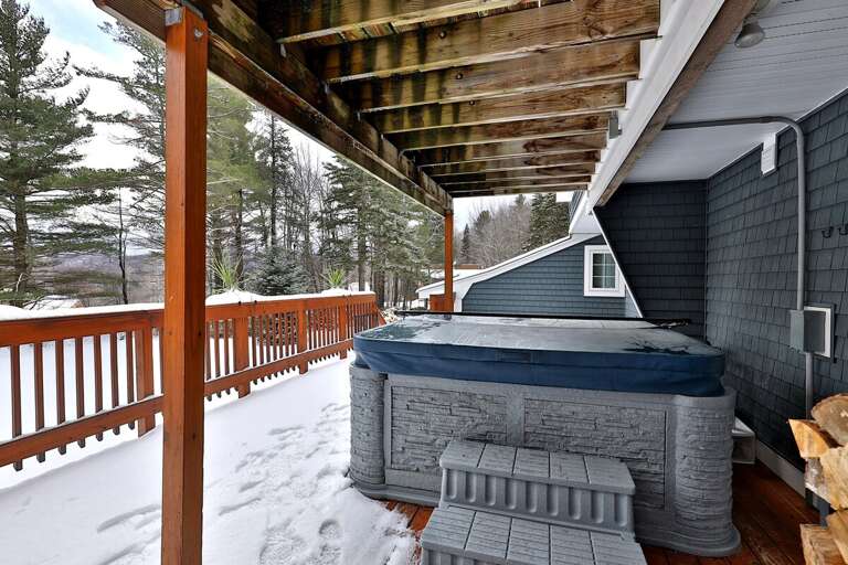 Front deck with hot tub in the winter time