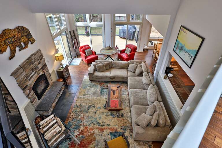 Aerial view showing the massive sectional and open layout. Keep an eye on the fire while checking in from the loft.