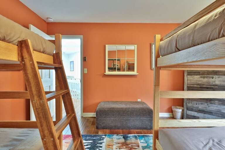 Bunk room with sturdy wooden beds. Perfect for the cousins to share stories after lights out.