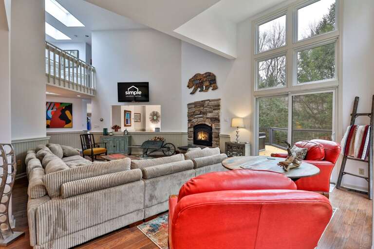 Open flow from the living room to the loft. A social space designed for gathering, not separating.