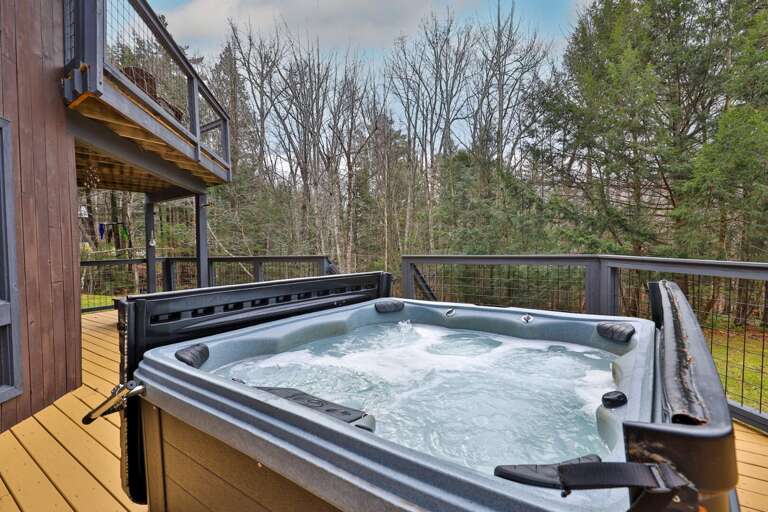 Private hot tub overlooking the tree line. The only schedule you need to keep is 