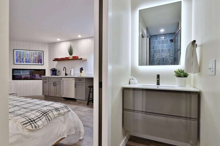 Backlit mirror and modern vanity. Get ready for a day on the mountain or a night out.