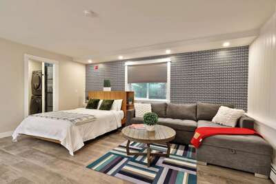 The comfortable queen sleeper sofa, perfect for relaxing by the fire or hosting extra guests.