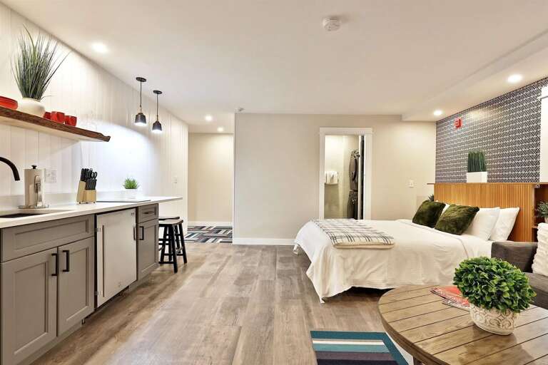 A modern, open studio with clean lines and a cozy fireplace. Your private Killington base camp.