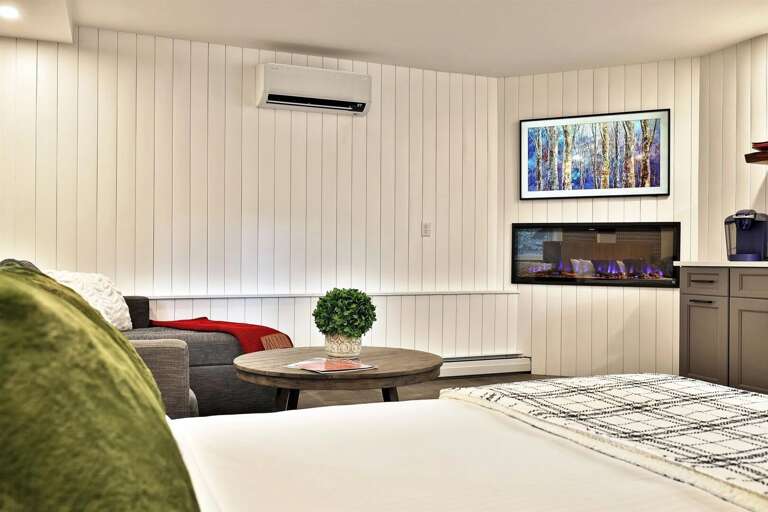 A modern, open studio with clean lines and a cozy fireplace. Your private Killington base camp.