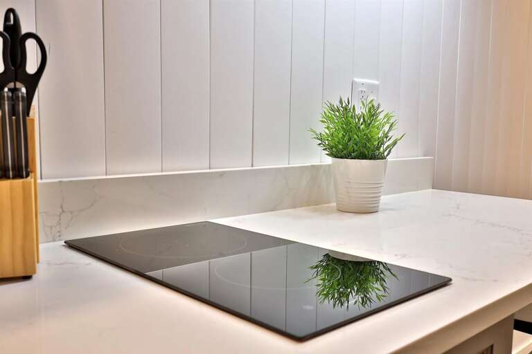 Sleek kitchenette with a 2-burner cooktop and Keurig. Perfect for morning coffee or a light après-ski meal.