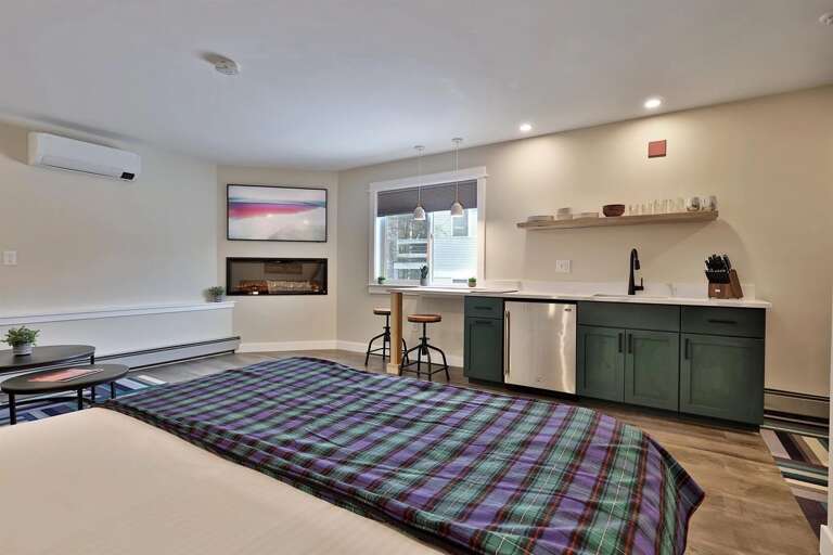 The stylish kitchenette and electric fireplace. Everything you need for your Killington getaway.