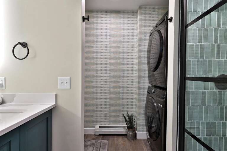 In-unit stacked washer and dryer. Pack half as much and leave with clean clothes.