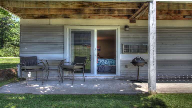 Enjoy your meal outdoors on our patio, furnished with a table and chairs for your comfort.