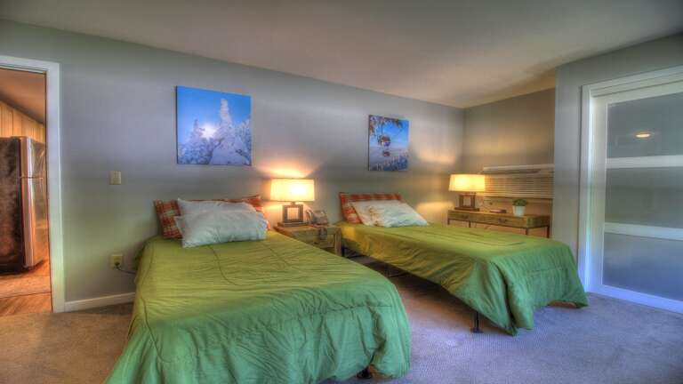 Experience comfort in the primary bedroom which can be split into  two cozy twin beds.