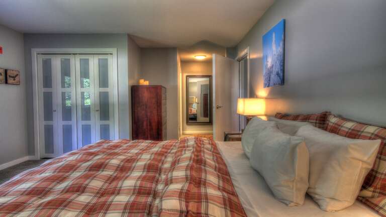 Experience the cozy ambiance of our comfy bedroom, adorned with a charming comforter.
