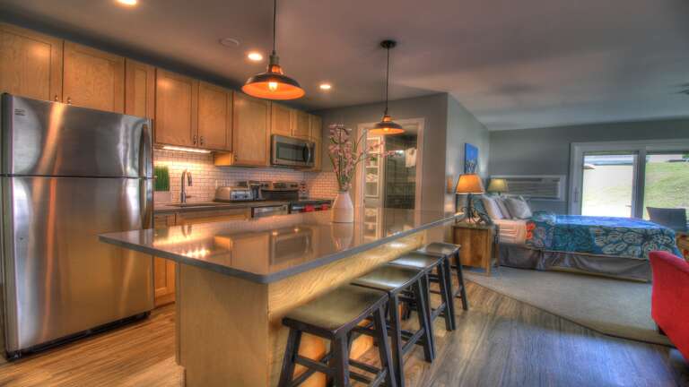 The property features a fully-equipped kitchen fitted with modern, stainless steel appliances.