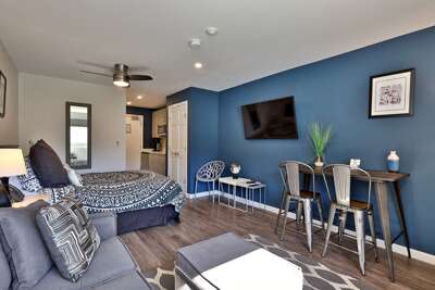 Cozy studio at Killington Center Condos. Plush queen bed, sleeper sofa, smart TV, kitchenette, and counter-height table to enjoy your meals.