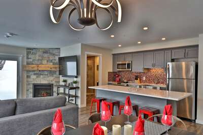 Renovated 2-room, 2-bath condo with a fully equipped kitchen, private patio with an electric grill, and access to a heated outdoor pool.