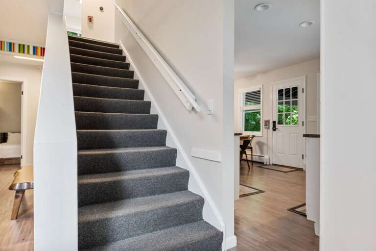 The central staircase connects the home's two main levels.