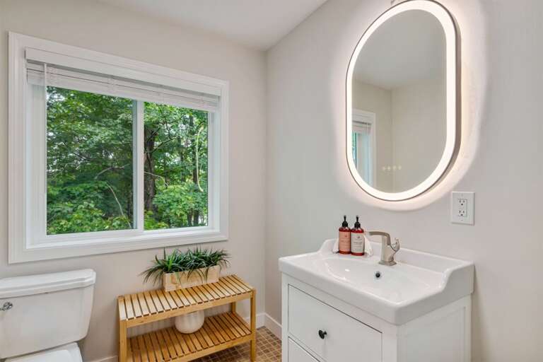 Get ready beside the window, with a lighted mirror above the sink.