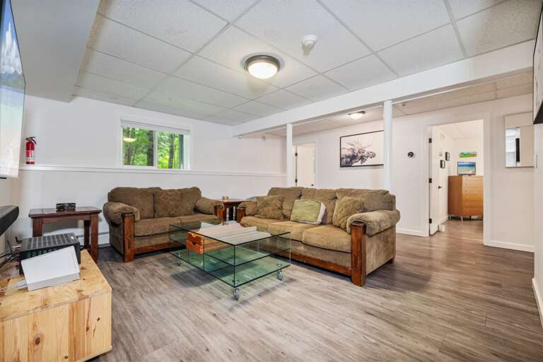 The roomy downstairs lounge has another TV when the group wants a separate place to hang out.
