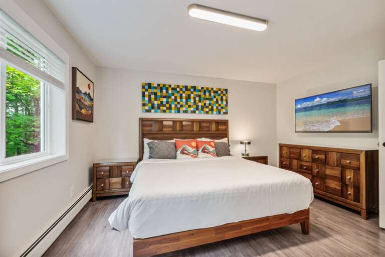 Unpack into the wide dresser and relax with a show from bed.