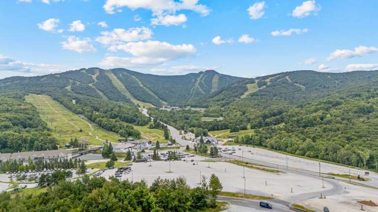 The aerial view looks directly toward Killington's trails and the base area below.