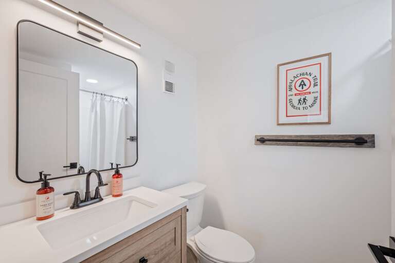 A full bath beside the living room gives the main floor an extra convenience.