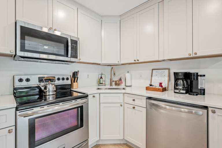 The full-size range, microwave, dishwasher, and coffee maker cover breakfast through dinner.