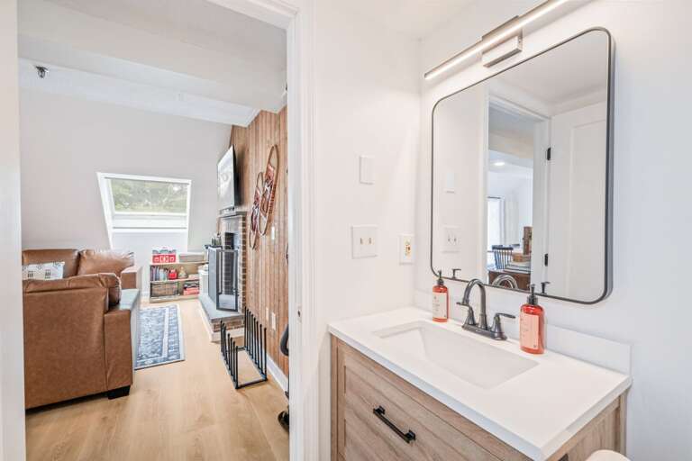 The main-floor full bathroom is easy to reach without heading upstairs.