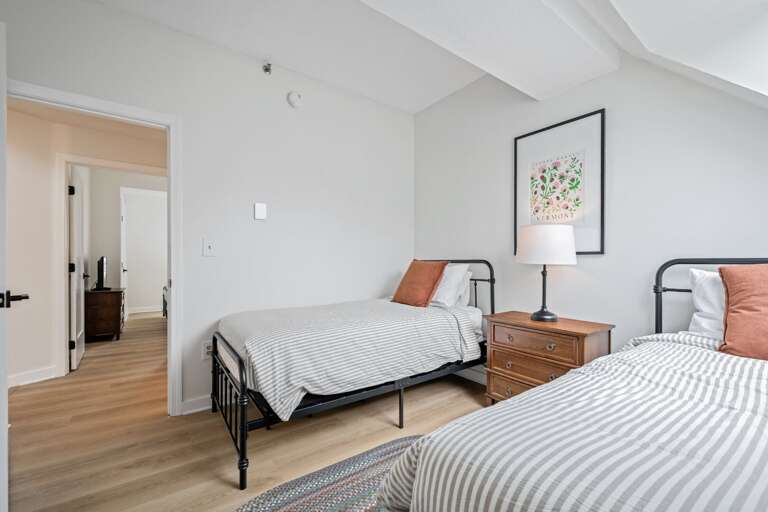 Two separate beds and a shared nightstand make the room a practical choice for travel companions.