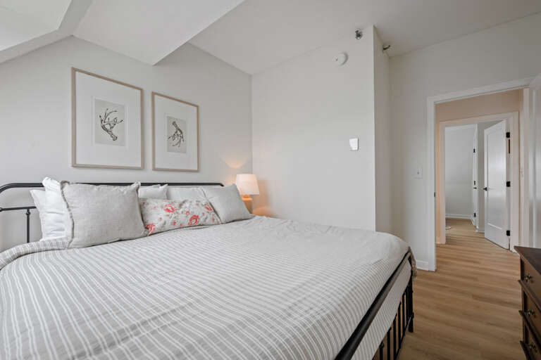 Sleep comfortably in the king-size bed with bedside lamps on both sides and the upstairs hall and full bath just outside the door.