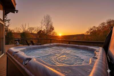 RoundTop Chalet features a private hot tub with panoramic Green Mountain views.