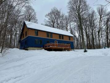 Winter exterior view of The Cabin at Killington, our vacation rental home in Killington, Vermont.