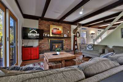 This is the moment you're booking. Drop your gear, light the fire, and unwind. This is your classic Killington ski house experience, waiting for you after a long day on the slopes.