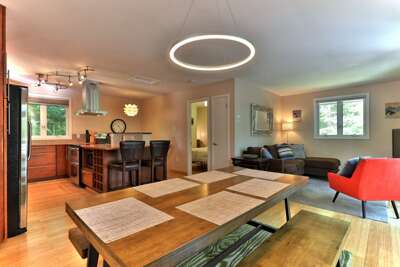 One of two living areas in this chic retreat just off the main road in Killington, VT. Open kitchen
