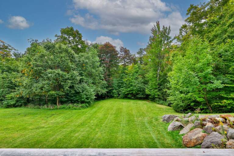 Take your coffee outside and look across the lawn to the trees beyond.
